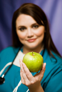 66_3_Young_Doctor_Offering_Apple